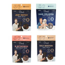 Four packages of Drool dog treats with images of a man and his dog on a white background - Zach's Pet Shop